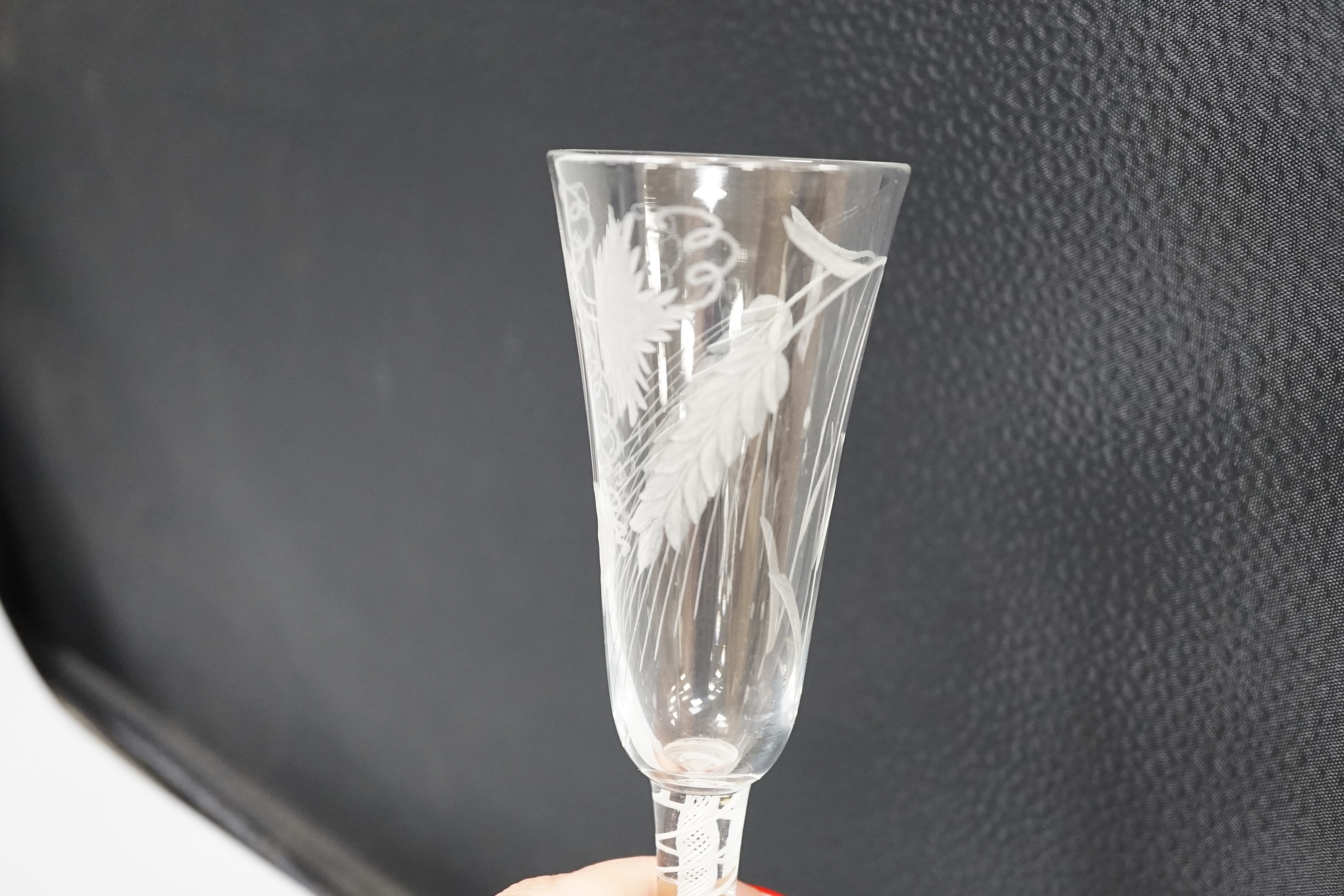 An English lead crystal DSOT ale glass, c.1760, elongated round funnel bowl finely engraved with hops and barley, DSOT stem, pair heavy tapes outside plain gauze, conical foot, snapped pontil, 18.8cm high